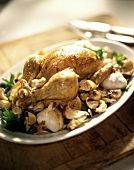 Roast chicken with garlic on platter