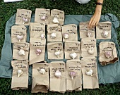 Various varieties of garlic on bags with variety name