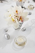 Center of Hanukkah Table with Flowers, Rocks and Candle