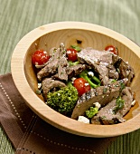 Bowl of Sliced Beef with Broccoli, Cherry Tomatoes and Gorgonzola Cheese
