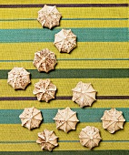 Many Chocolate Meringue Cookies on Striped Cloth