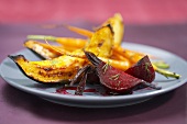 Plate with Wedges of Roasted Beets and Squash and Carrots