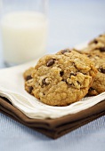 Chocolate Chip Cookies on a Napkin with a Glass of Milk