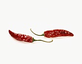 Two Red Chili Peppers on a White Background