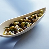 Assorted Marinated Olives with Cheese in an Olive Dish