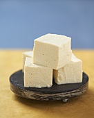 Cubes of Tofu Stacked on a Plate