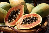 Basket of Whole Papayas, One Cut in Half