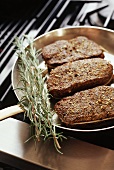 Coriander and Mustard Crusted Strip Loins in Skillet on the Oven
