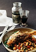 Lamb Shank on Bed of Sun-Dried Tomatoes and Cannellini Beans