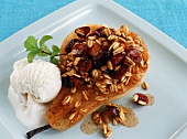 Baked Pear with Granola and Dried Cranberries; Scoop of Vanilla Ice Cream