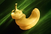 Hot Yellow Pepper on a Green Background