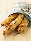 Loaves of Onion Bread Wrapped in a Towel