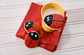 Three Lady Bug Cookies with a Cup of Milk