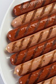 Assorted Grilled Hot Dogs on a Plate