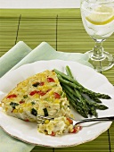 Piece of Vegetable Quiche; Fork with Piece of Quiche