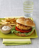 A fish burger with chips