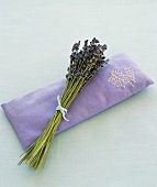 Lavender flowers on a lavender eye pillow