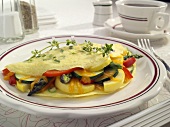 Veggie and Cheese Omelet on a Plate on Breakfast Table