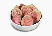 Bowl of Halved Guava on a White Background