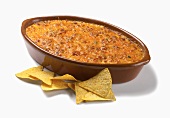 Baked Nacho Dip with Corn Chips on a White Background