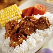 BBQ Pork Tenderloin Pieces Over White Rice with Corn and Tomatoes