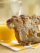 A Slice of Apple Cinnamon Bread with a Glass of Orange Juice