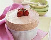 Frozen Strawberry Souffle in a Souffle Dish Topped with Fresh Strawberries