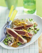 Partially Sliced Tuna on a Bed of Rice with Edamame