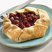 Rustic Cherry Pastry on a Blue Plate