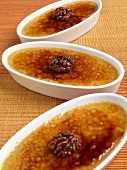 Three Individual Pumpkin Creme Brulee with Caramelized Walnuts; Close Up