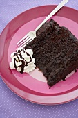 Slice of Chocolate Layer Cake with Chocolate Fudge Frosting; Pink Plate