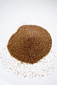 Pile of Teff Seeds on a White Background