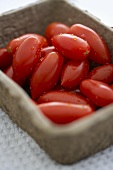 Freshly Washed Plum Tomatoes in a Carton