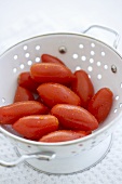 Freshly Washed Plum Tomatoes in a Colander