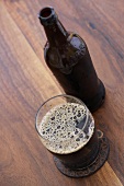 Imported Chocolate Malt Wheat Beer in a Glass with Bottle