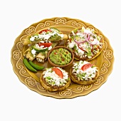 Platter of Tostadas and Taquitos with Guacamole, White Background