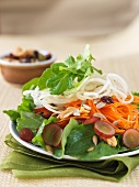 Carrot salad with onions, raisins, grapes and nuts