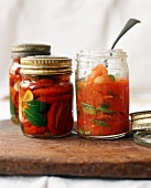Two Jars of Sundried Tomatoes and a Jar of Tomato Sauce