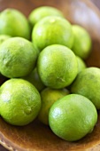 Key Limes in a Wooden Bowl