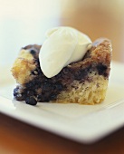Piece of Blueberry Crumble with Cream Dollop
