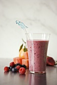 Fruit Smoothie in a Glass with Bird Stirrer