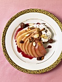 Poached Pear in Pomegranate Sauce; Sliced Almonds and Raisins