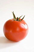 Whole Red Tomato on a White Background