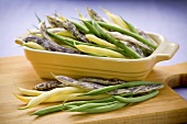 Variety of Fresh Beans In a Dish and on Cutting Board