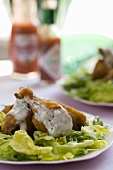 Spicy Chicken Wings with Blue Cheese Dressing Over Lettuce