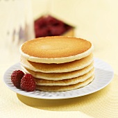 Stack of Pancakes on a Plate with Raspberries