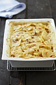 Scalloped Potatoes with Bacon and Cheese in Baking Dish