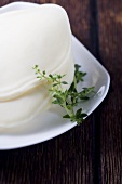 Freshly Sliced Provolone Cheese with Thyme Sprig