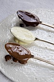 Spoonfuls of Melted Chocolate; Milk, White and Dark