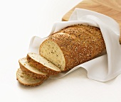 Partially Sliced Loaf of Multi Grain Bread